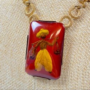 Vintage made in France reverse painted pendant of a man carrying produce
